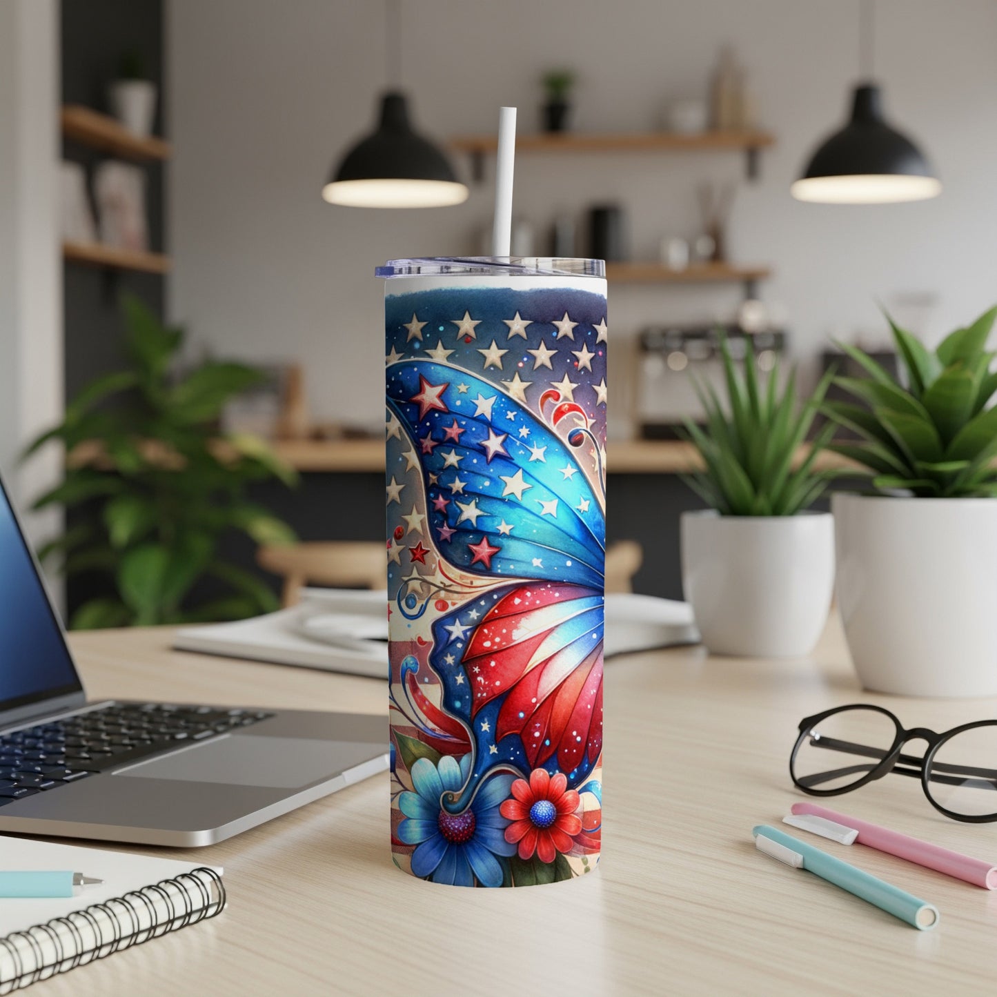 Patriotic butterfly tumbler with red, white, and blue stars and flowers.