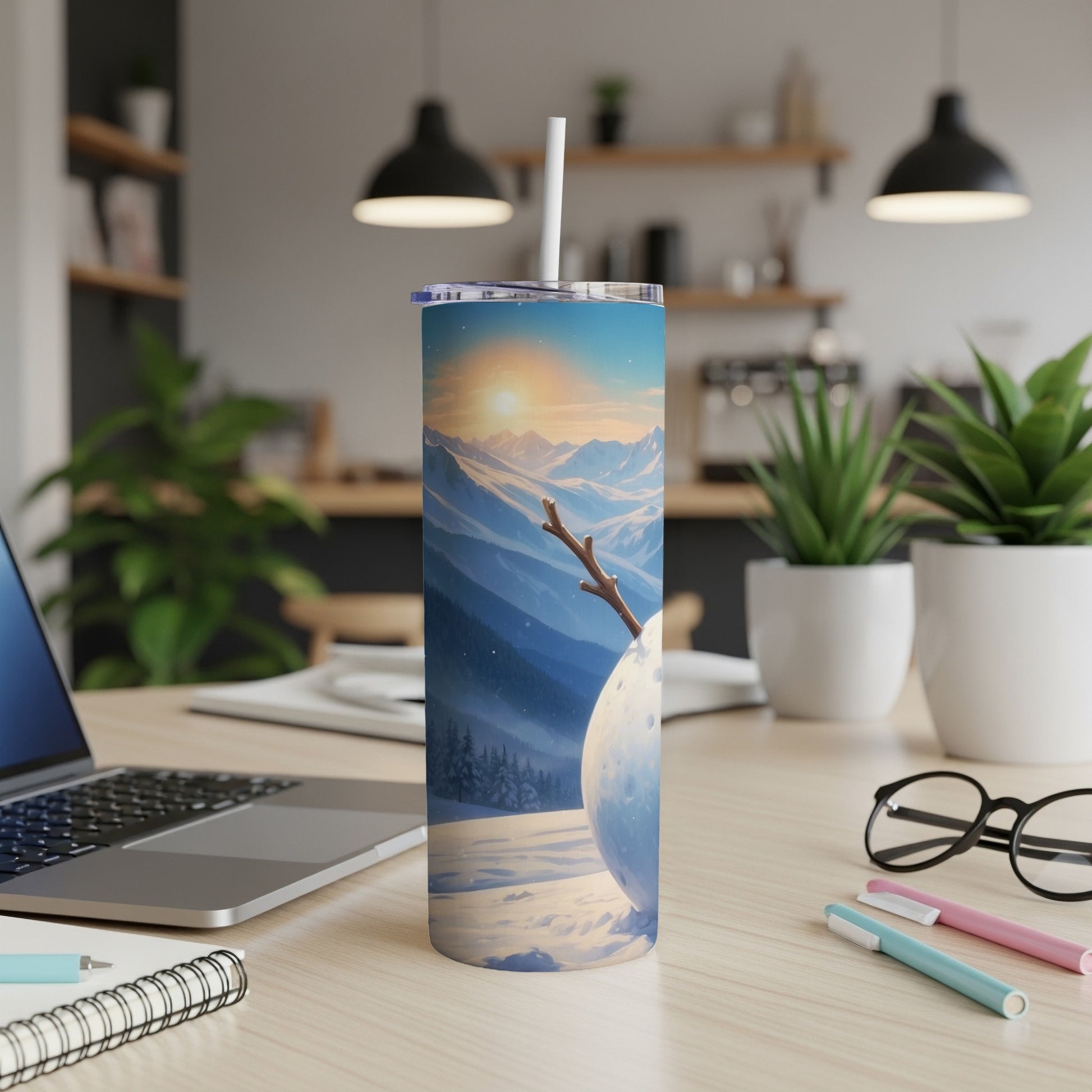 Snowman and snowy mountains on a skinny tumbler with a straw.