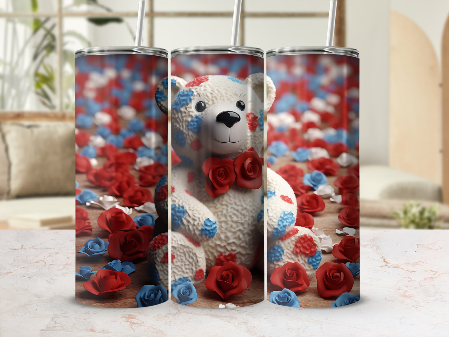 Teddy bear tumbler with red, white, and blue flowers on a marble surface.
