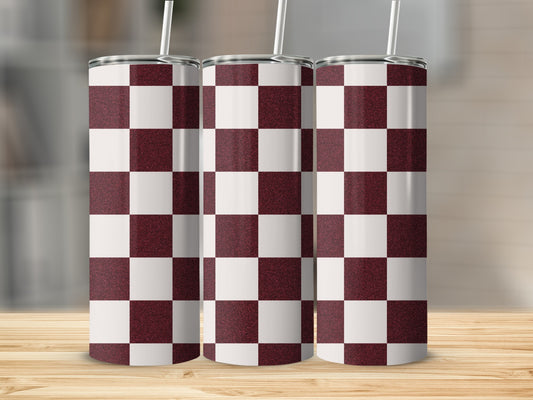 Three tumblers with maroon and white checkerboard pattern and straws.