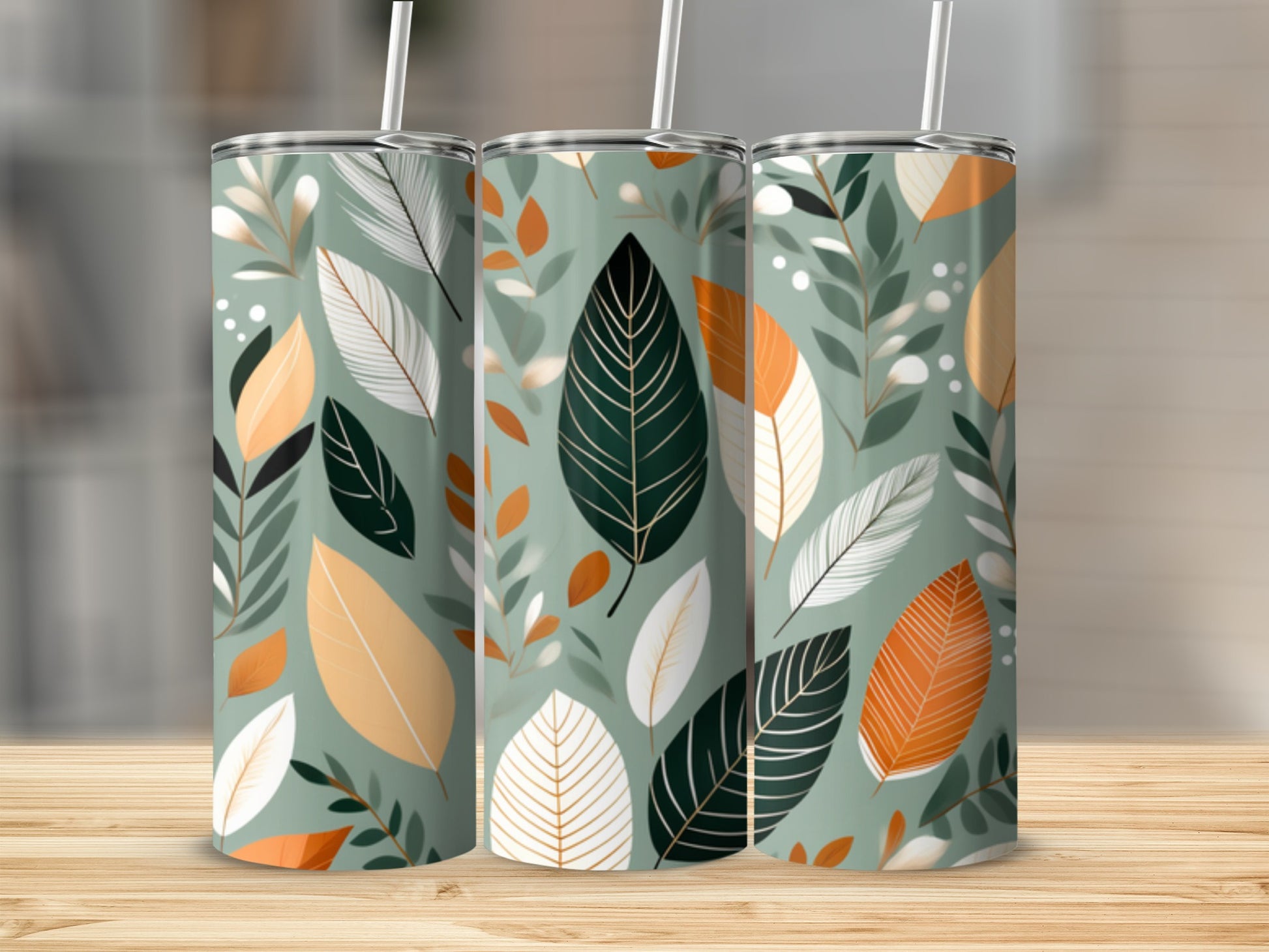 Three tumblers with green, white, and orange leaf pattern.