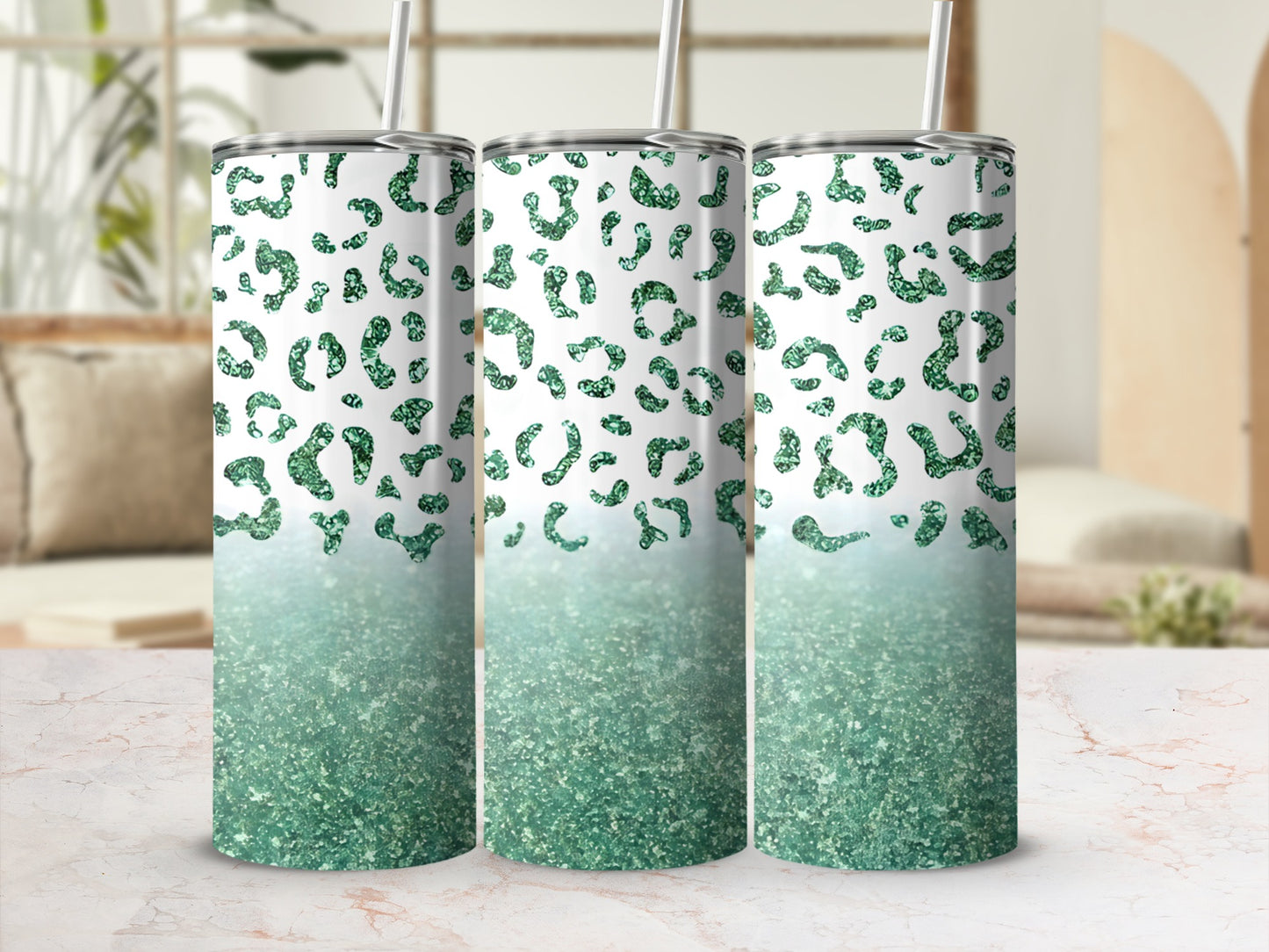 Three glittery green leopard print tumblers with straws.