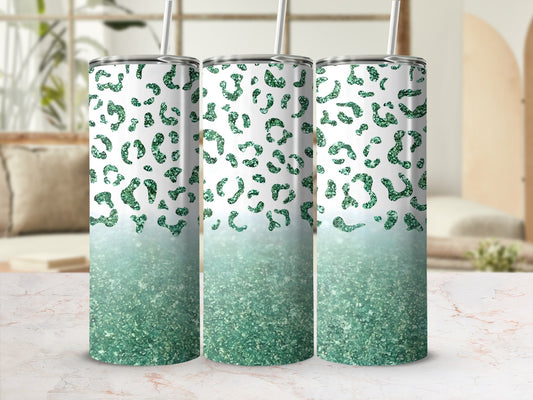 Three glittery green leopard print tumblers with straws.