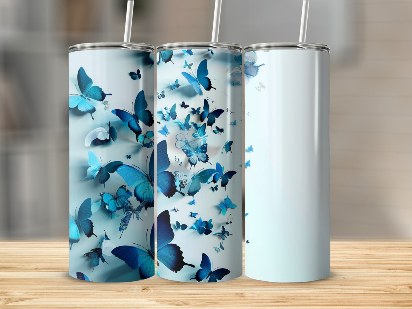 Blue butterfly pattern on a set of three tall, insulated tumblers.