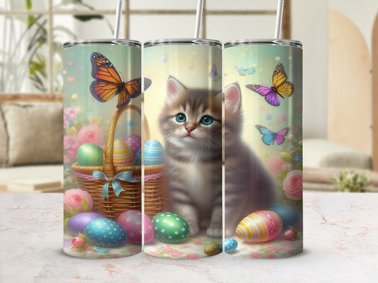 Cute kitten with Easter eggs and butterflies in a basket.