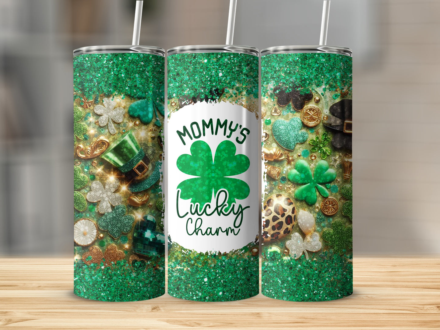 Green glitter tumbler with shamrocks and "Mommy's Lucky Charm" text.