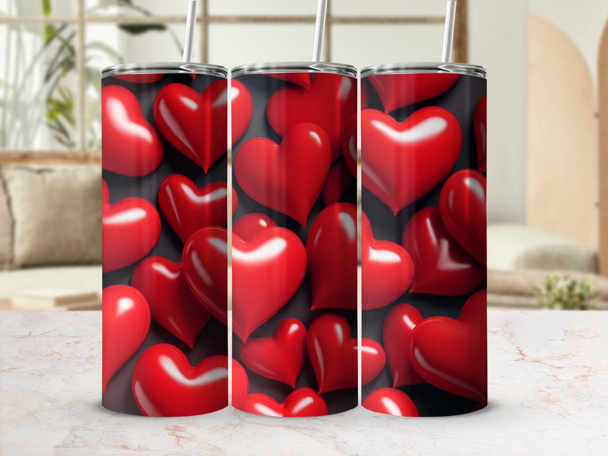 Three tumblers with a red heart pattern.