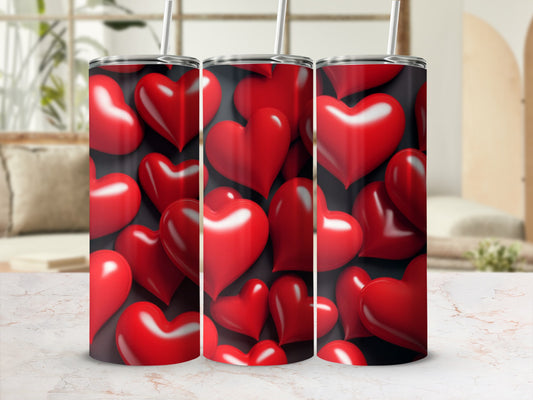 Three tumblers with a red heart pattern.