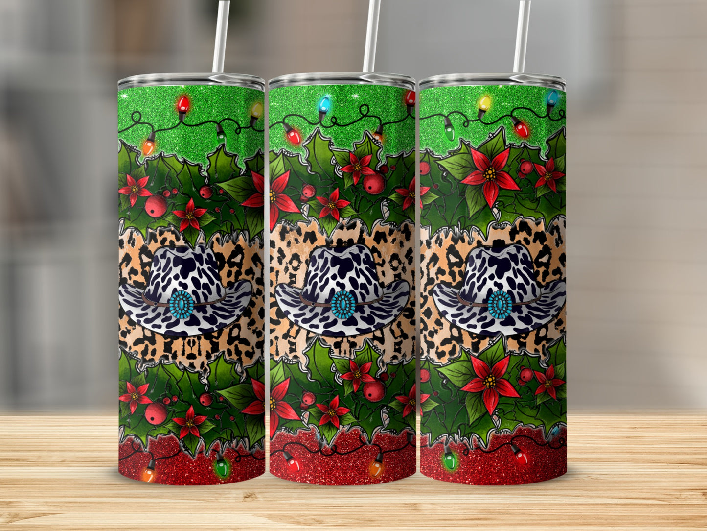 Three holiday tumblers with cowboy hats and Christmas lights.