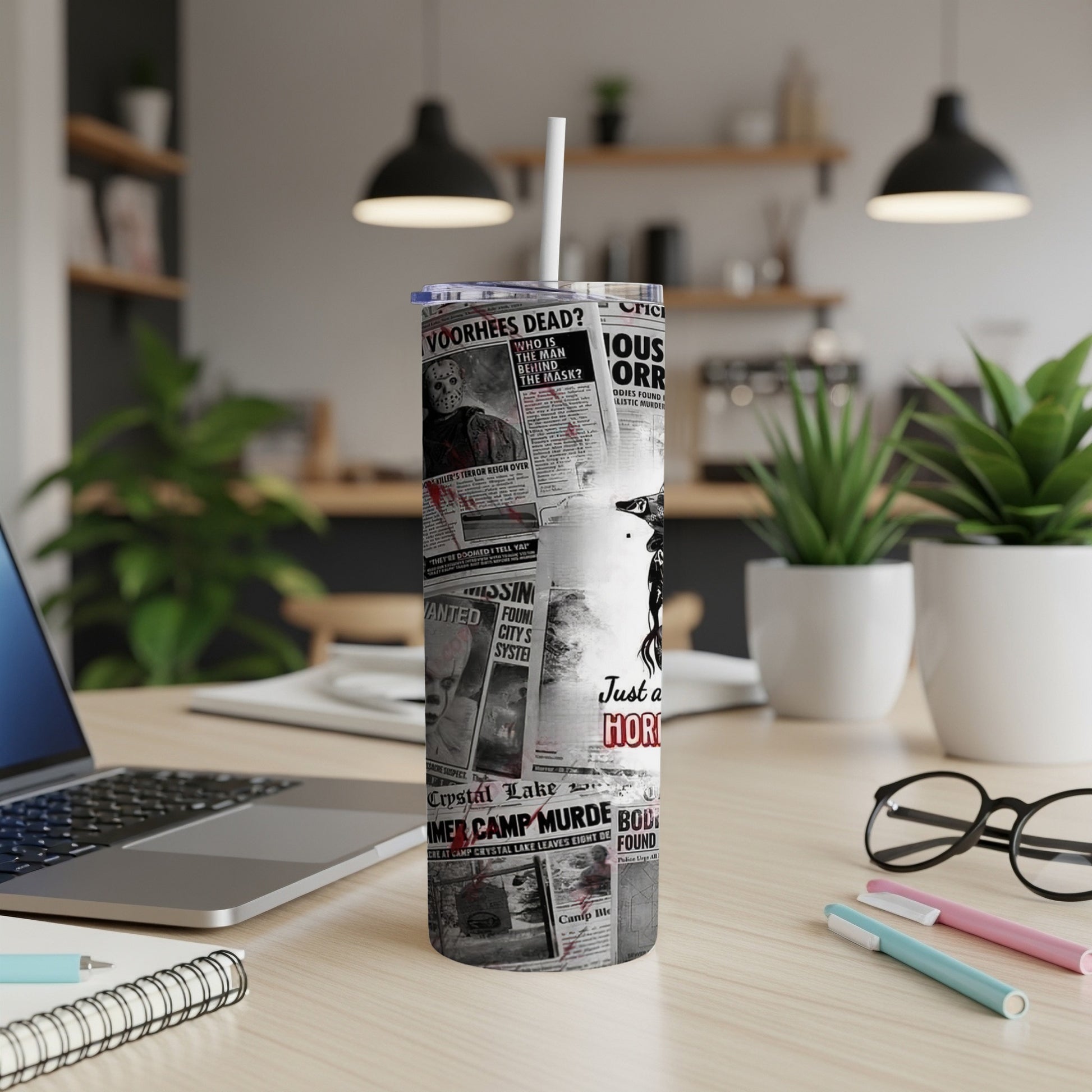 Tumbler with newspaper headlines and horror movie images.