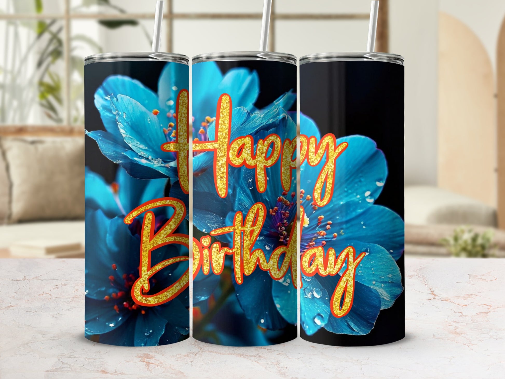 Blue floral tumbler with "Happy Birthday" text in gold glitter.