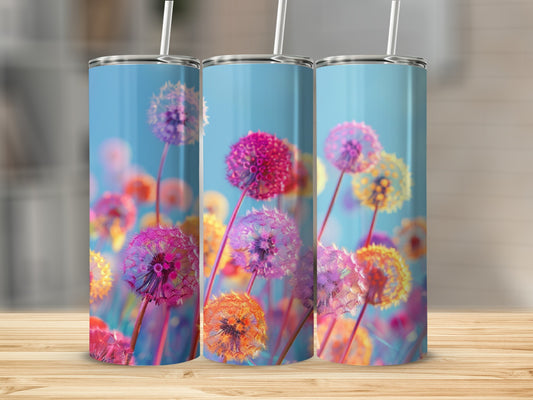 Three tumblers with dandelion floral design on a wooden surface.
