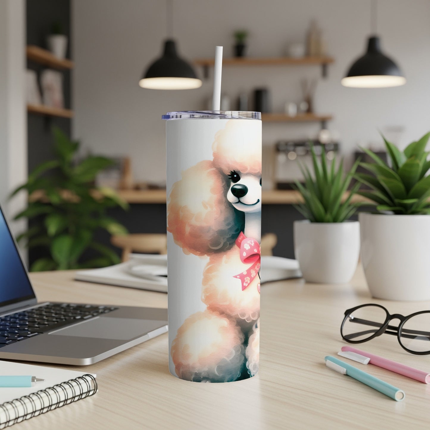 White poodle with pink bow on insulated tumbler with straw.