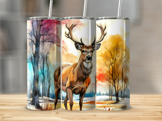 Watercolor deer and autumn trees on a set of three skinny tumblers.