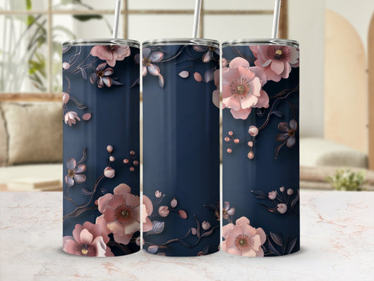 Navy blue tumbler with delicate pink floral design and metallic accents.