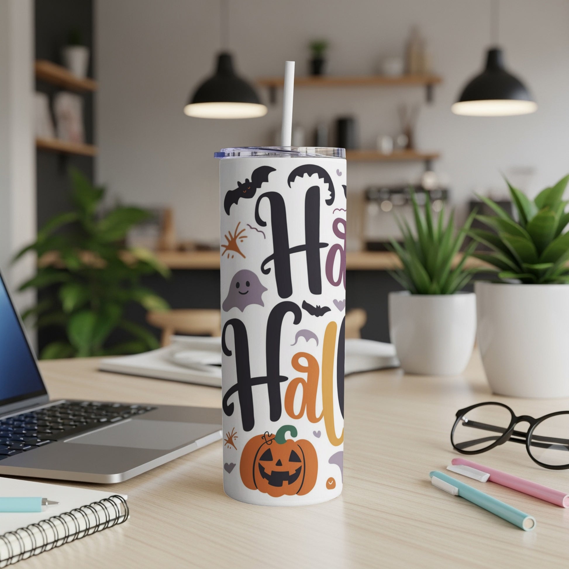 White tumbler with "Happy Halloween" text, pumpkin, ghost, and bats.