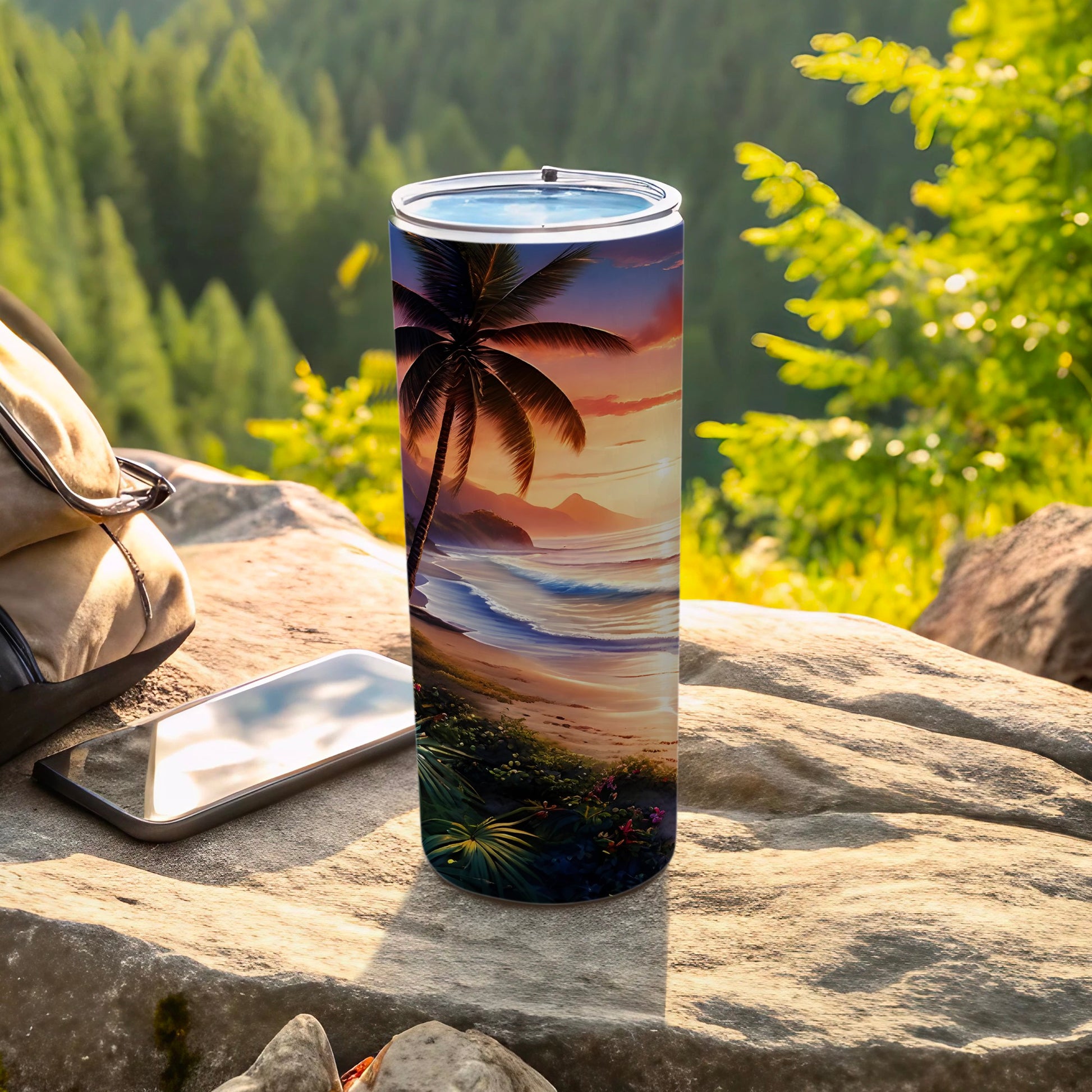 Palm tree on a beach at sunset tumbler on rocks with phone and backpack.