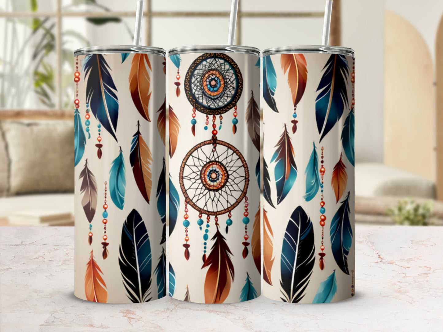 Three tumblers with dreamcatcher and feather designs.