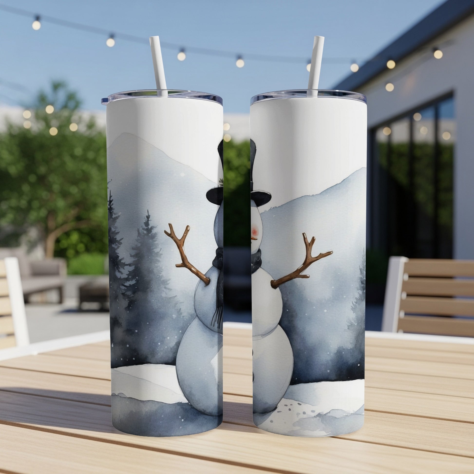 Snowman tumbler with black hat and scarf, winter landscape background.