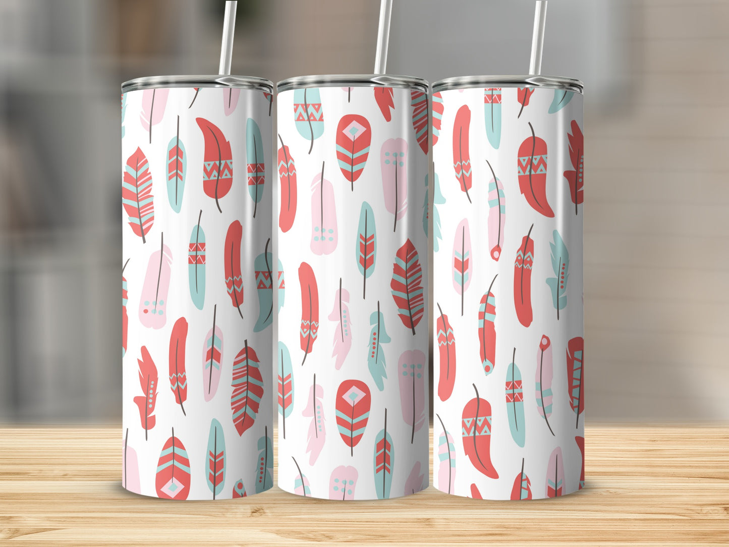 Three tumblers with a pink, teal, and red feather pattern.