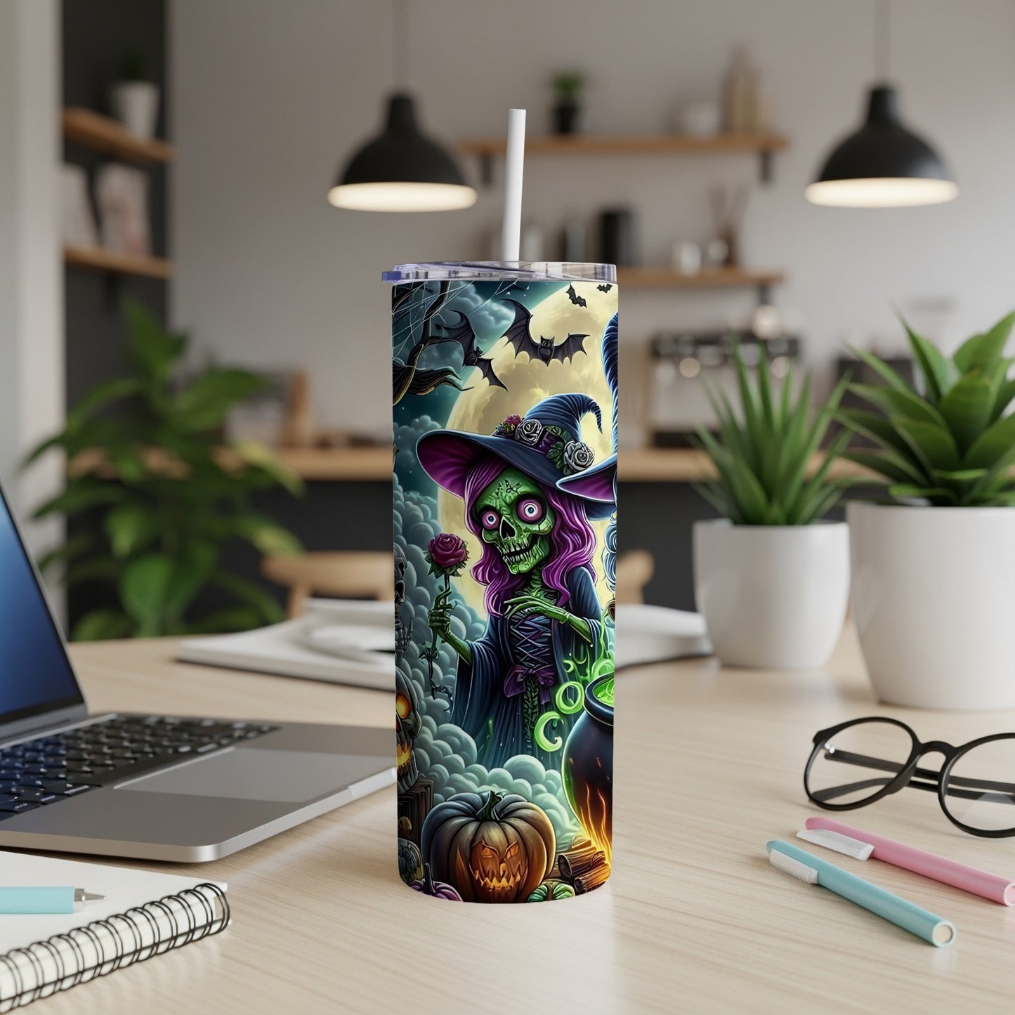Tumbler with Halloween witch, bats, moon, and jack-o-lantern design.