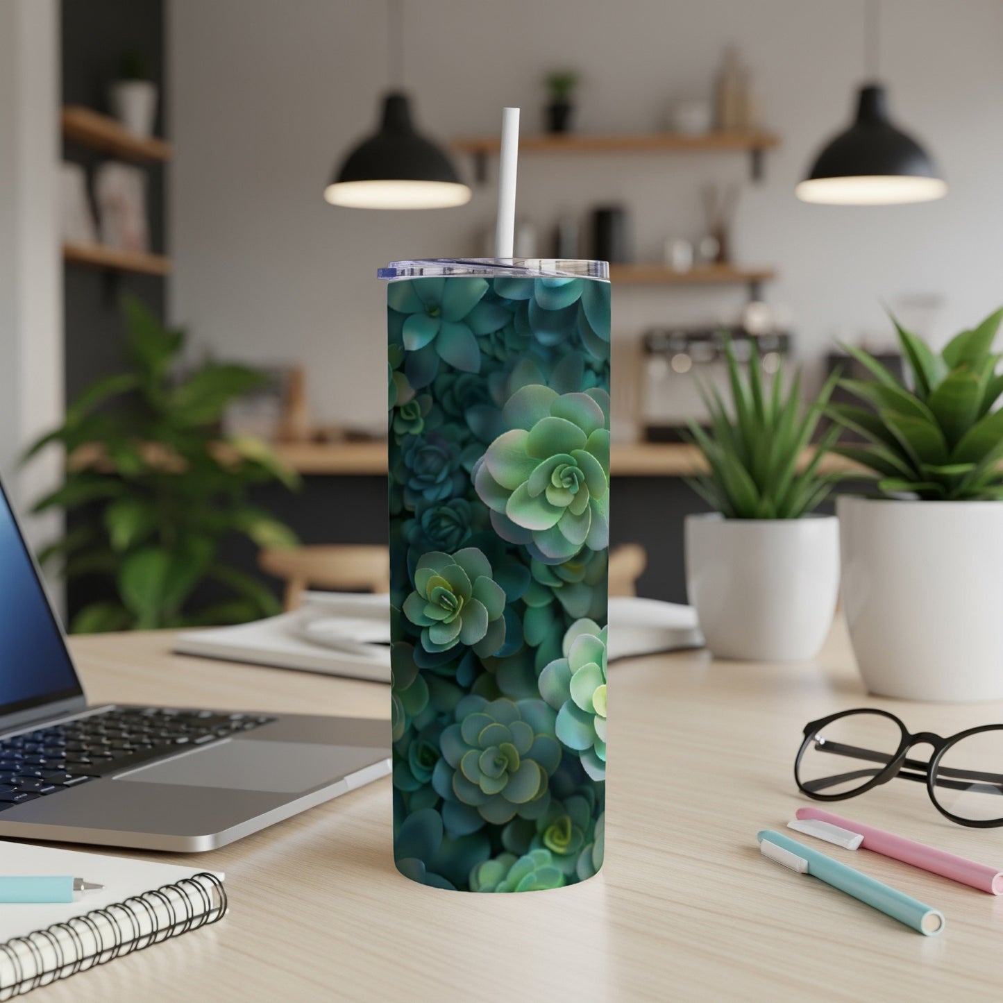 Green succulent plant pattern on a white skinny tumbler with a straw.