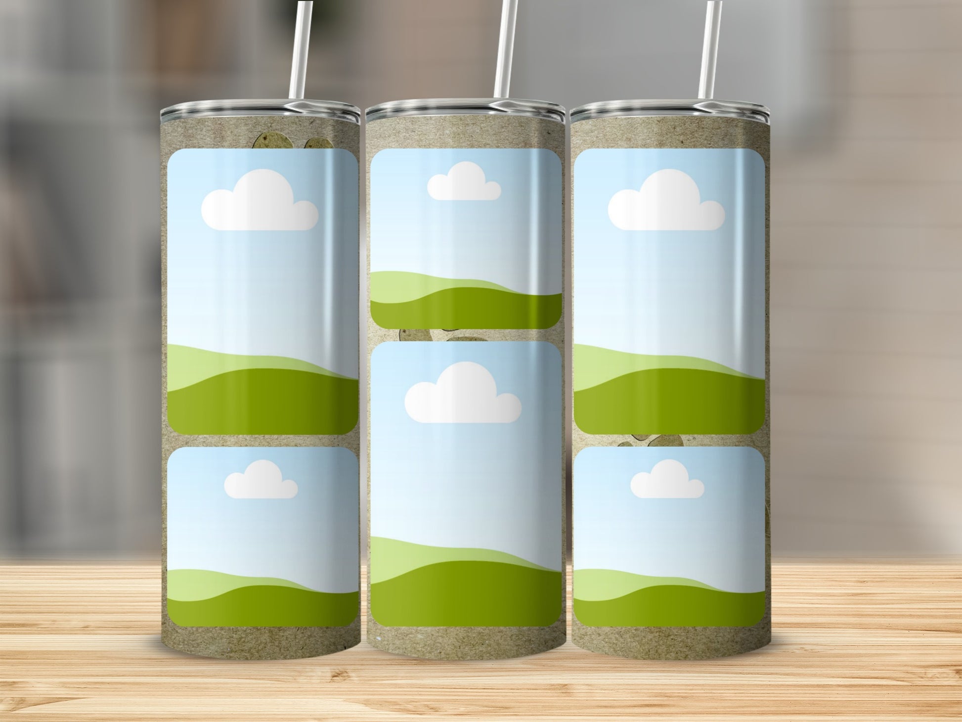 Three tumblers with a sky and rolling green hills design.