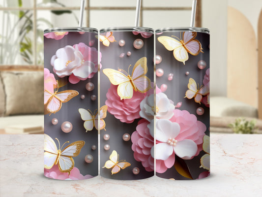 Three tumblers with pink flowers and golden butterflies on a gray background.