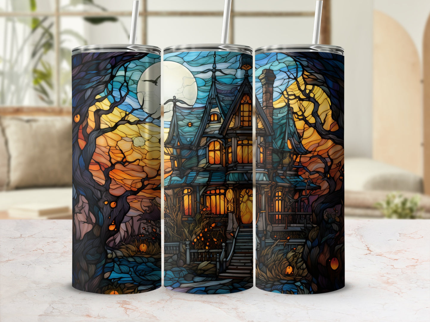 Spooky haunted house with moon and trees on a Halloween tumbler.