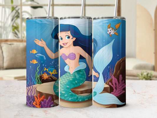 Ariel the mermaid with turquoise tail and fish in an underwater scene.