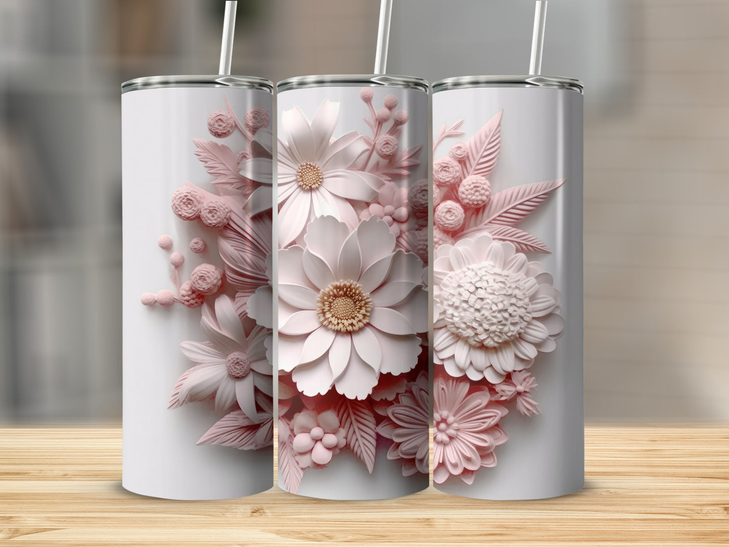 Three white tumblers with 3D pink floral designs and straws.