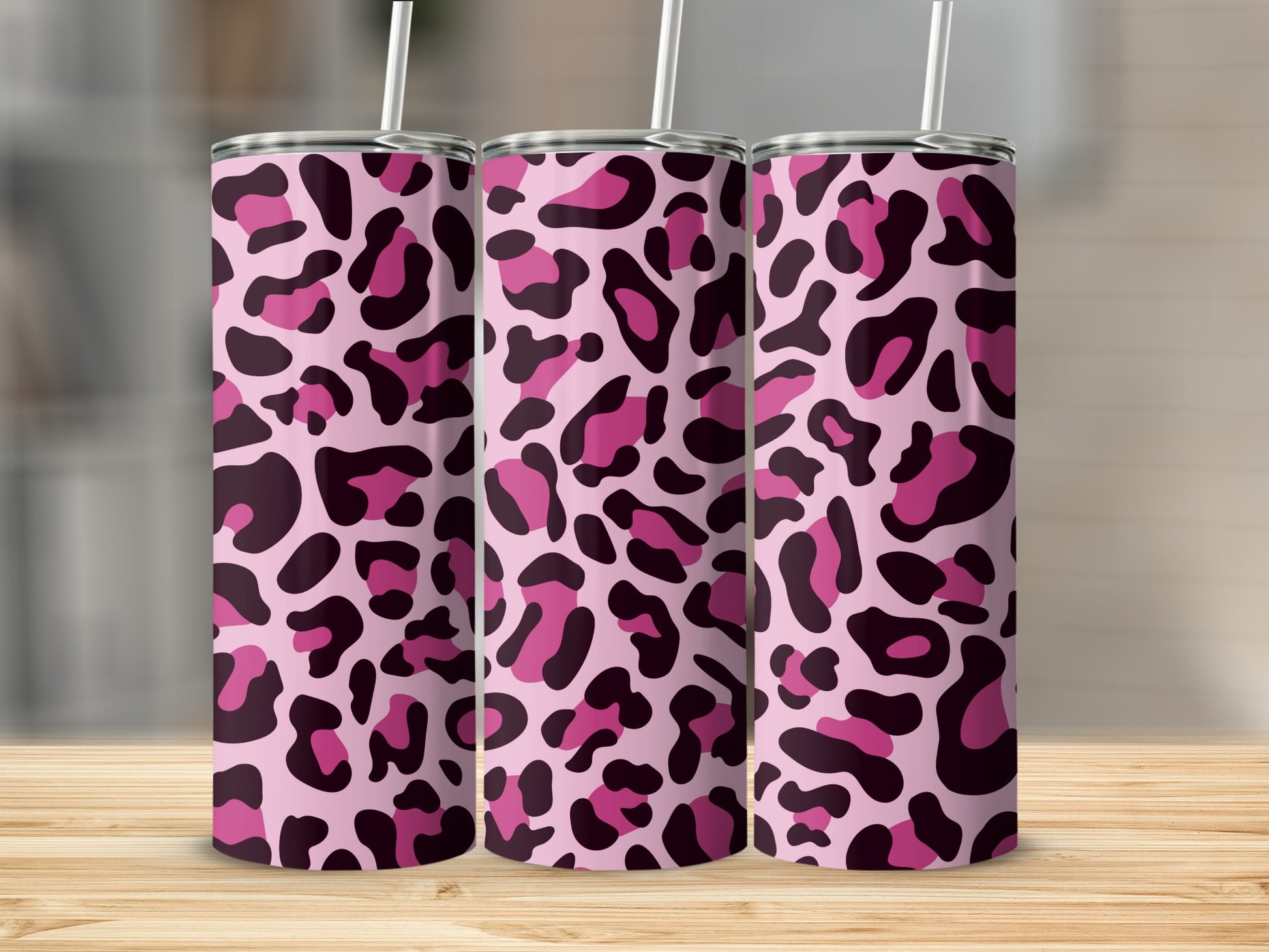Three pink tumblers with a black and hot pink leopard print pattern.