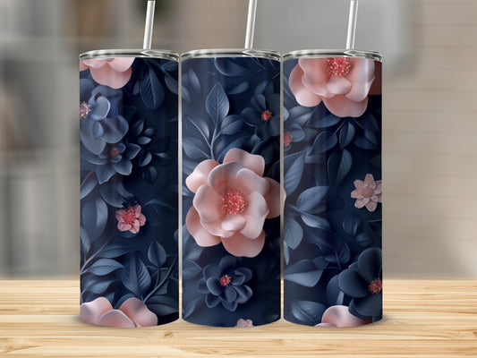 Dark blue tumbler with delicate pink and navy floral pattern and straw.