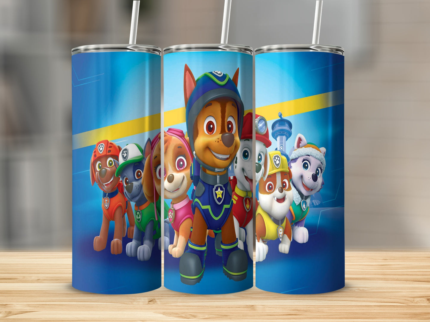 Three Paw Patrol character tumblers with blue backgrounds and cartoon dogs.