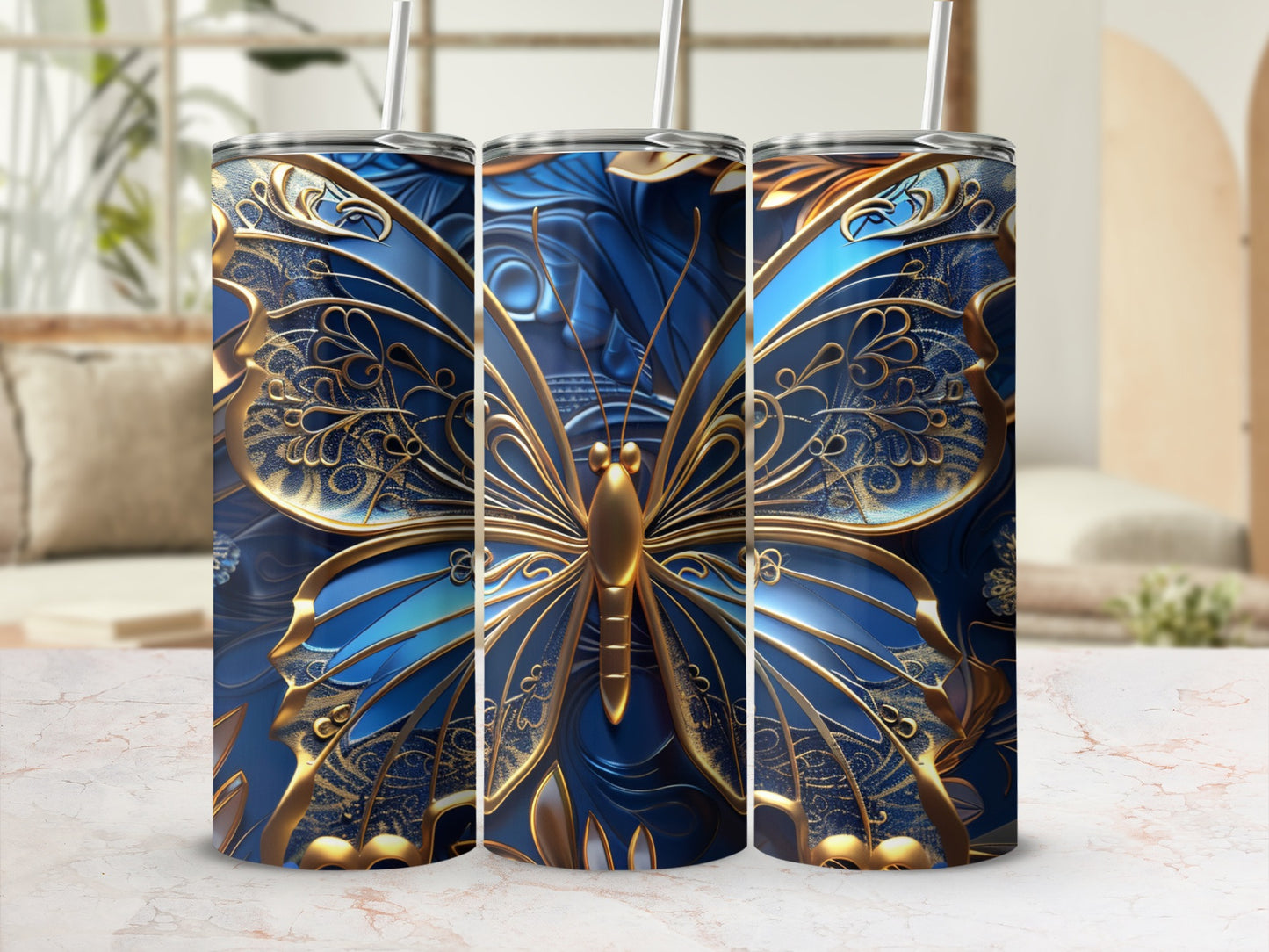 Three tall tumblers with ornate blue and gold butterfly designs.