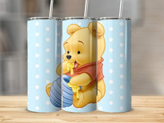 Adorable bear holding honey jar on blue polka dot tumbler
