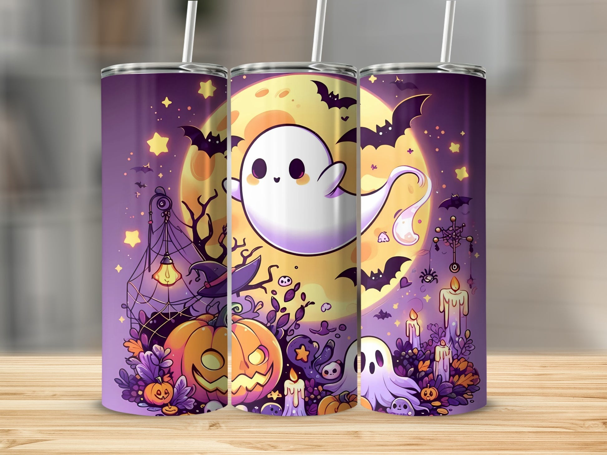 Three tumblers feature a cute Halloween design with ghosts, pumpkins, bats, and a full moon.