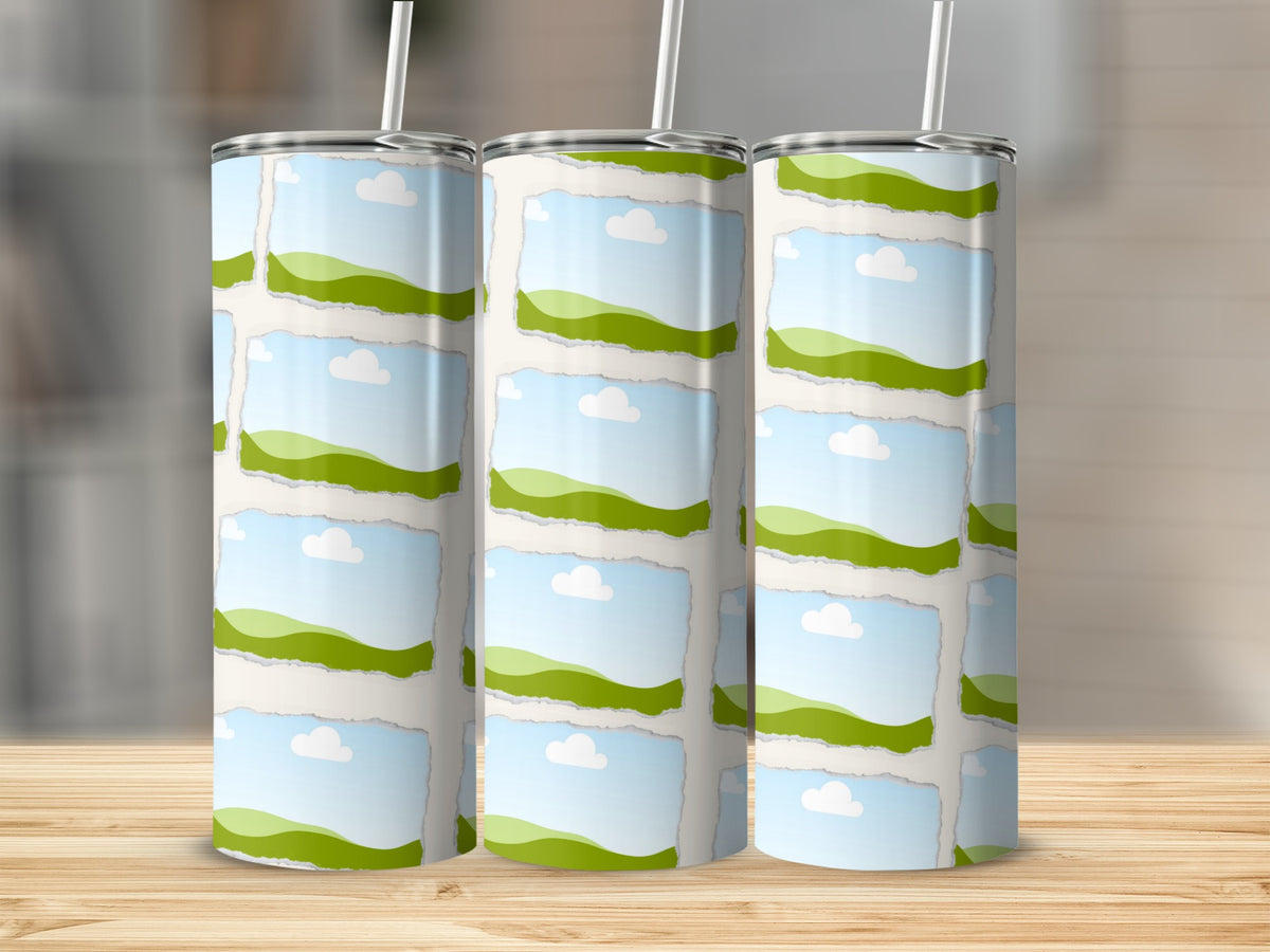 Three tumblers with a torn paper pattern featuring green hills and blue sky.