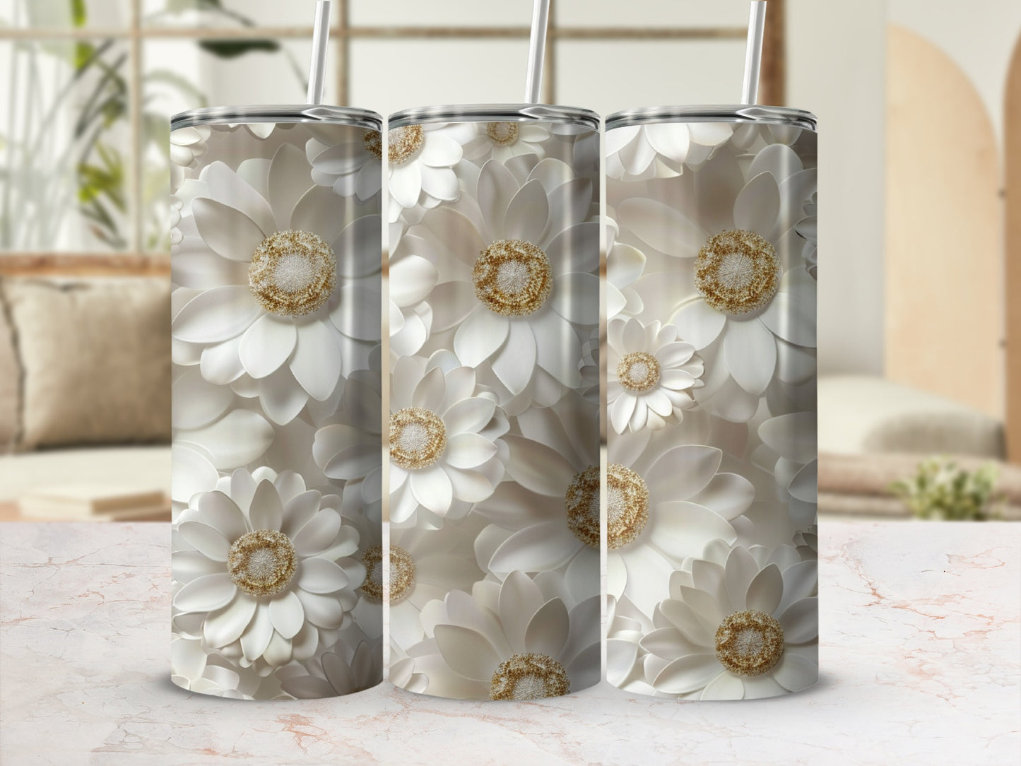 Three tumblers featuring white floral patterns with gold accents.