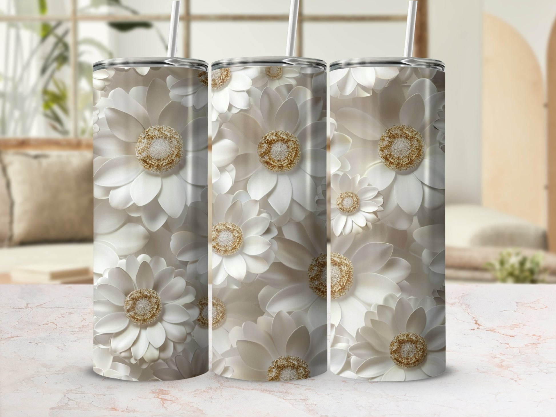 Three tumblers featuring white floral patterns with gold accents.