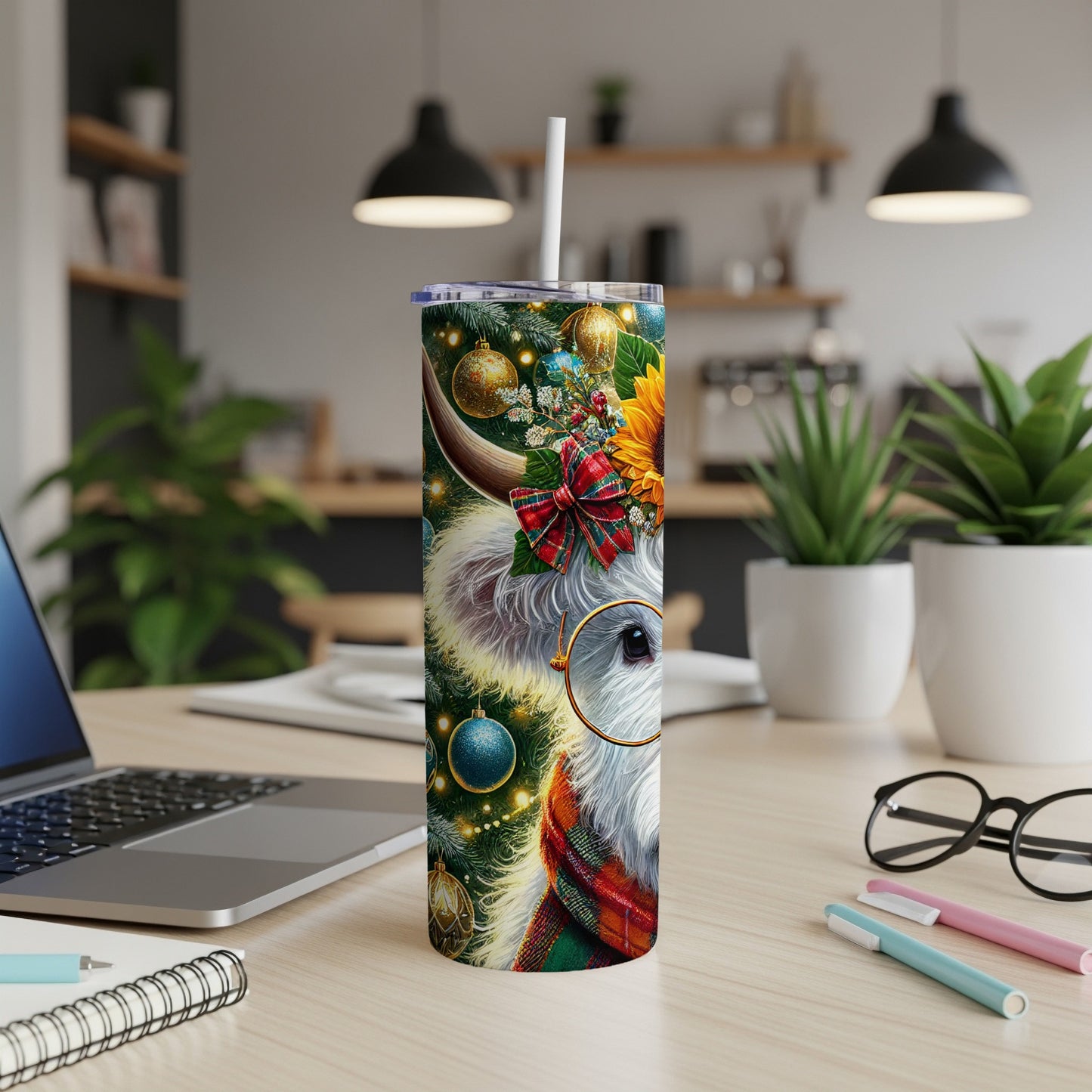 Christmas cow tumbler with festive decorations and plaid scarf.