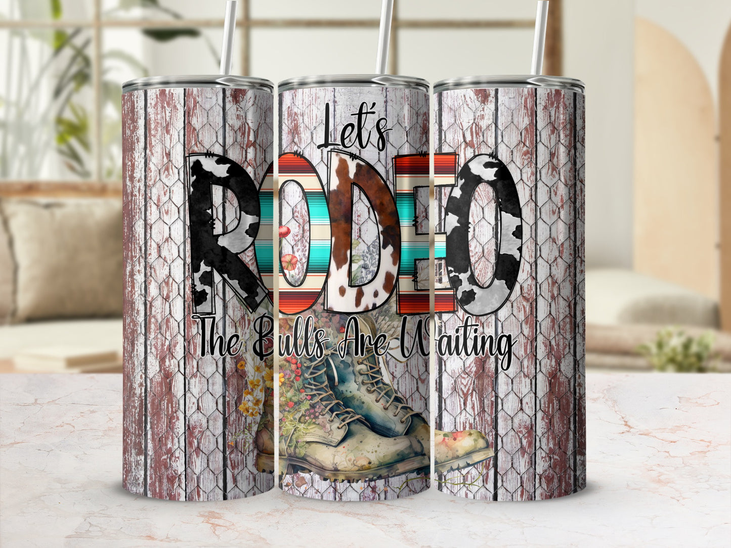 Cowboy boots and "RODEO" text on rustic wood and cowhide tumblers.