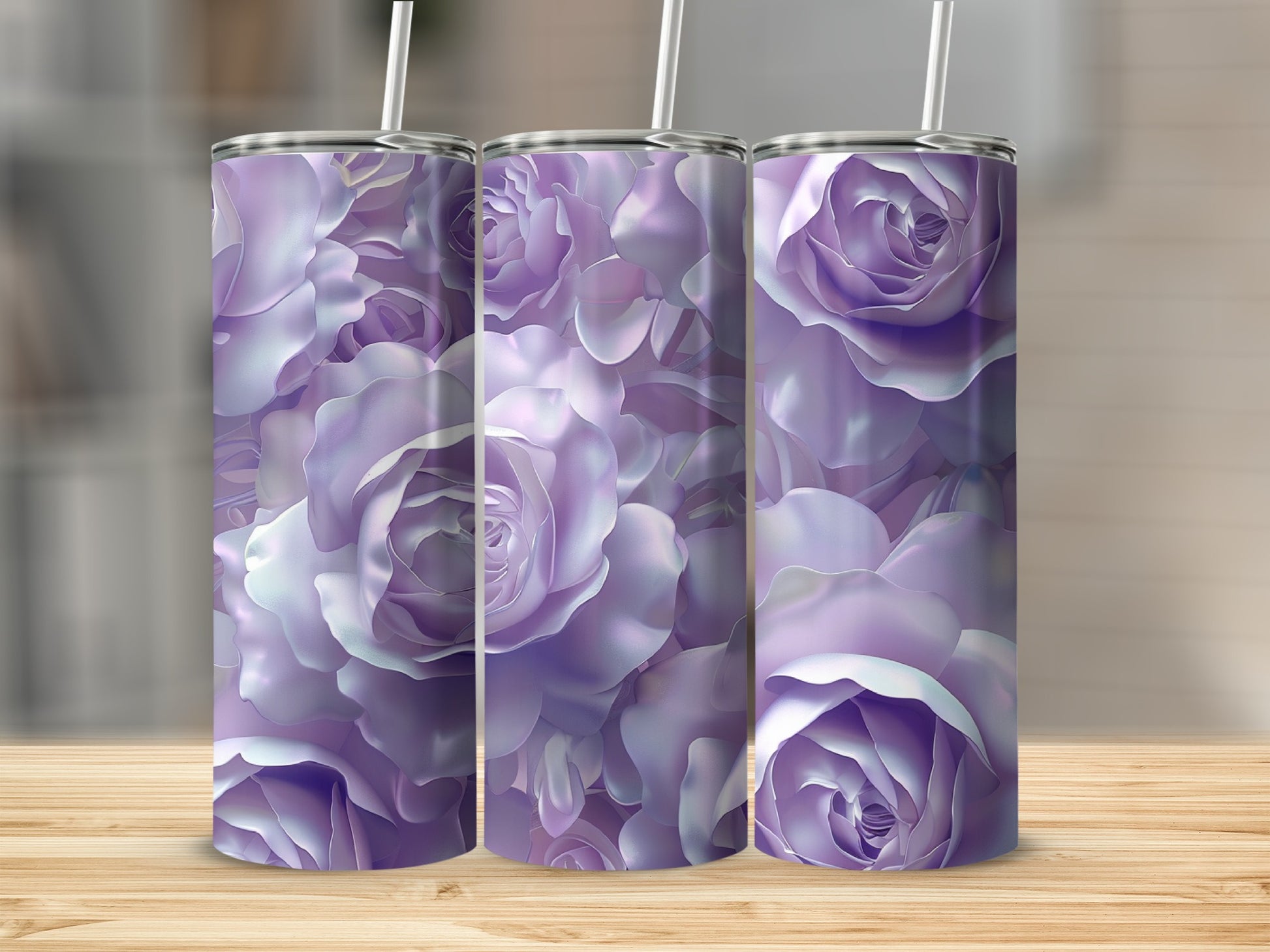 Three tumblers with a purple rose floral pattern on a wooden surface.