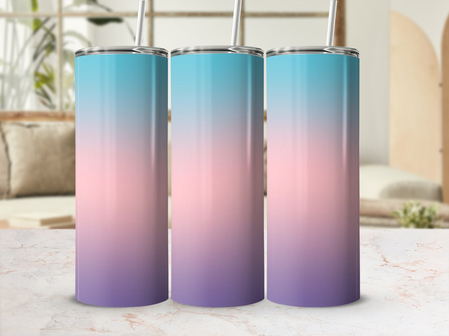 Three tumblers with a pink, blue, and purple gradient on a marble surface.