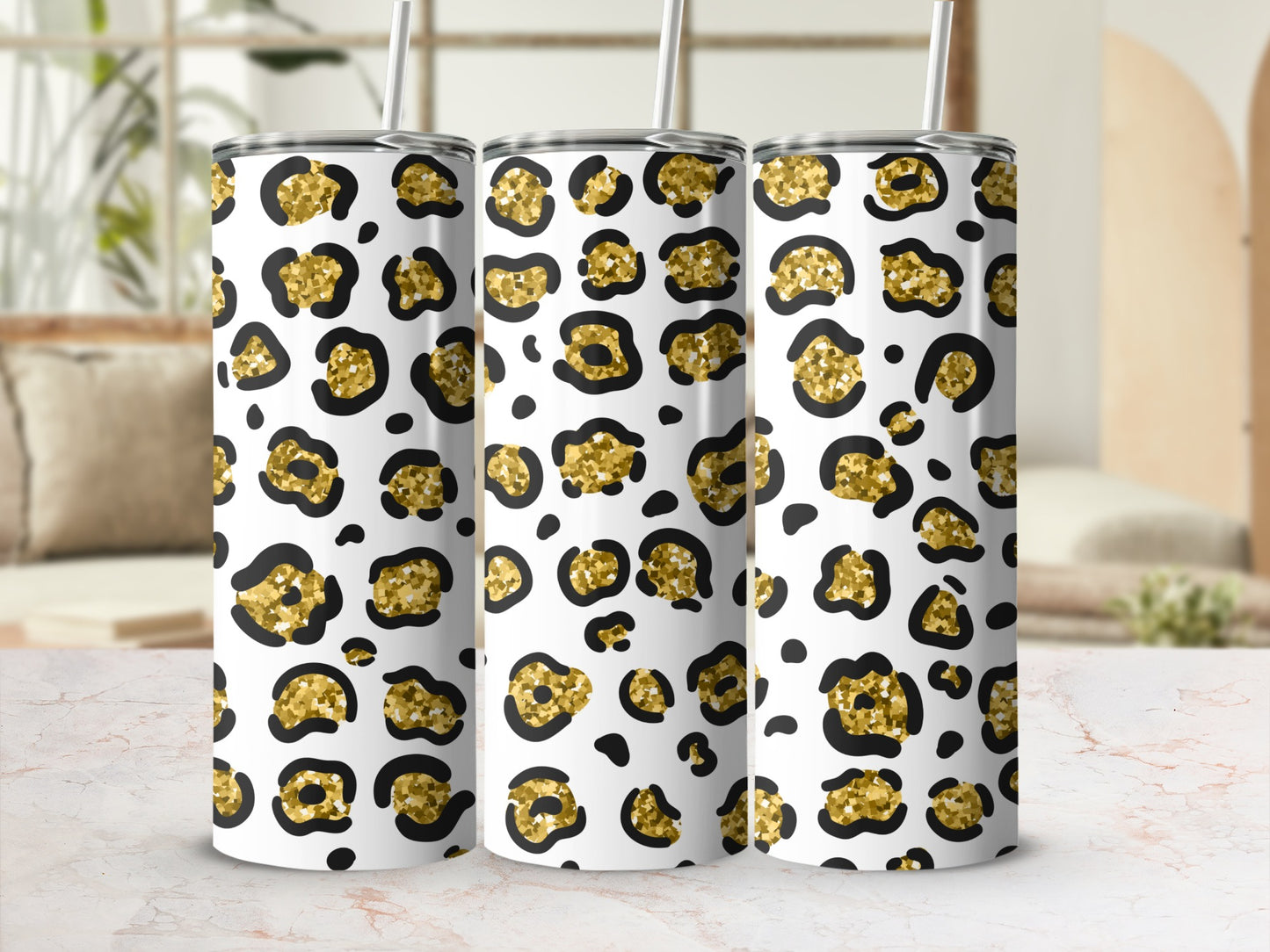 Three tumblers with a gold and black leopard print pattern.
