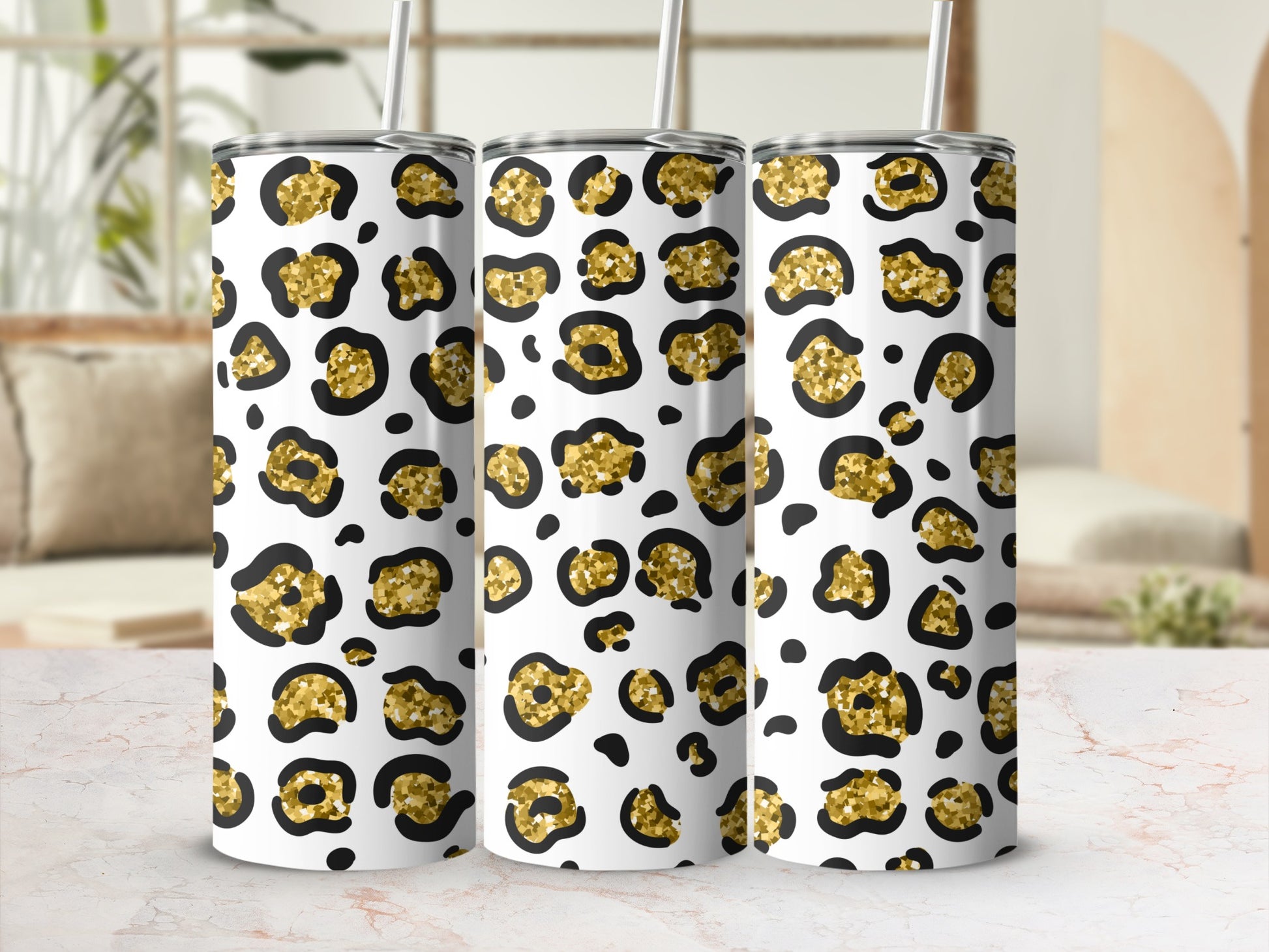 Three tumblers with a gold and black leopard print pattern.