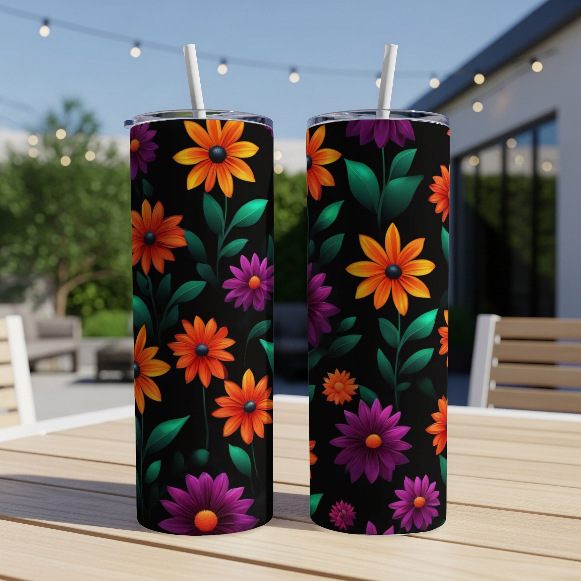 Black tumbler with vibrant orange and purple floral pattern.