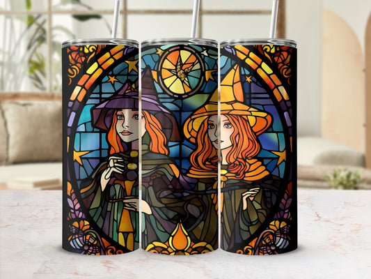 Stained glass tumbler with two witches under a starry sky.