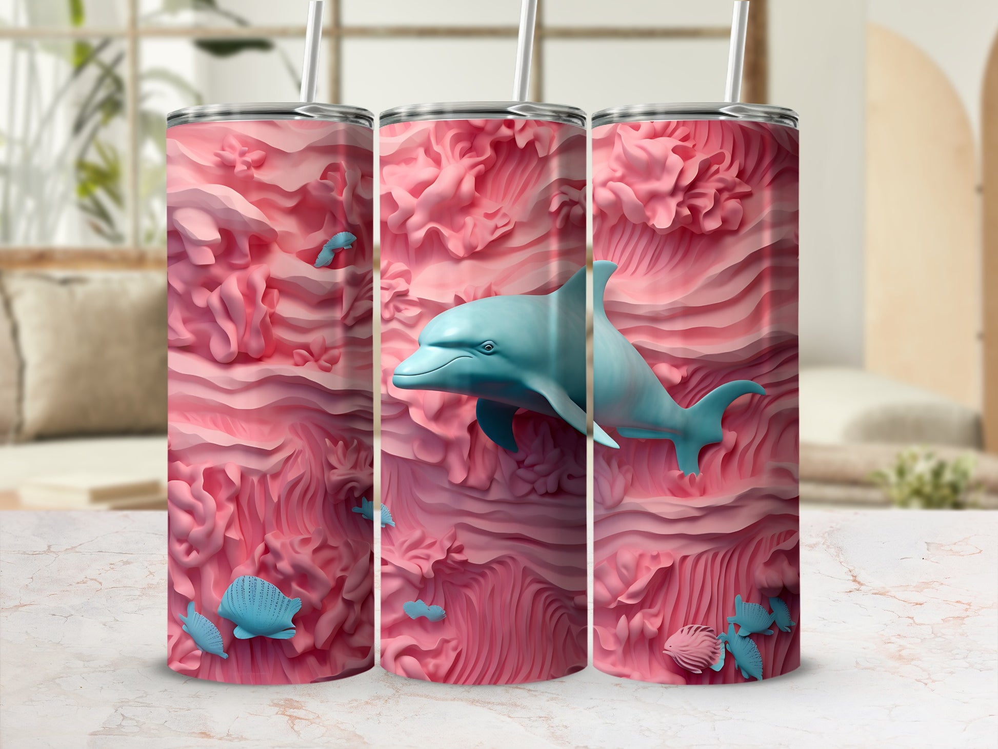 Pink coral reef with blue dolphin and shells, featured on three tumblers.