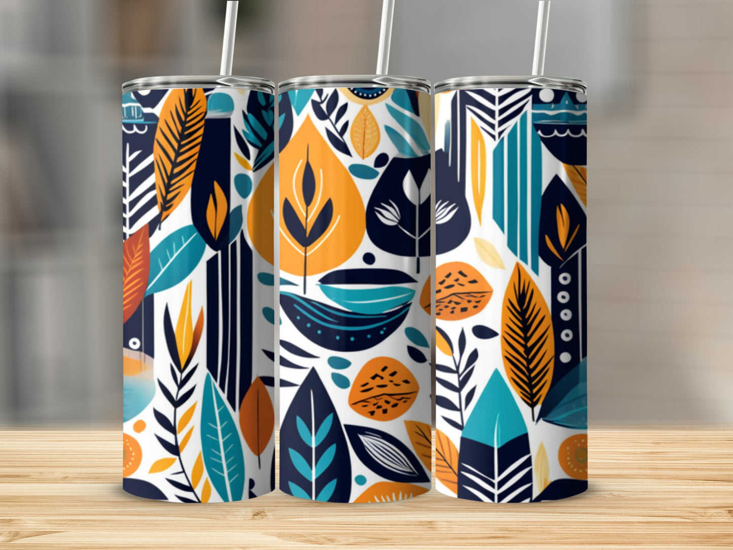 Three tumblers with abstract leaf and geometric pattern in blue, orange, and white.
